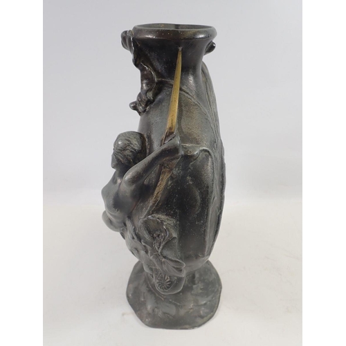 950 - An Art Nouveau pewter vase by Jules Jouant (1863-1921) cast maiden reclined along a gilt highlighted... 