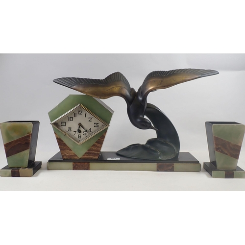 955 - An Art Deco marble and spelter clock garniture with spelter seagul, by Irenee Rochard, 51cm wide