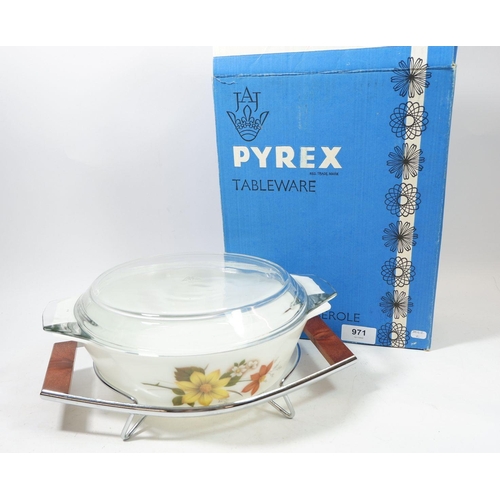 971 - A Pyrex vintage floral printed casserole dish on stand, boxed as new