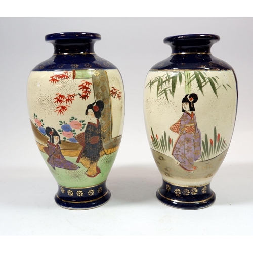 101 - A pair of Japanese satsuma vases painted ladies, 20cm tall