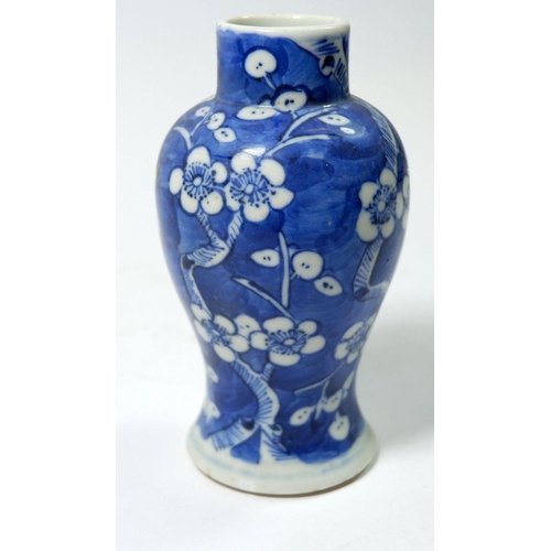 107 - A small Chinese prunus blossom vase with a four character mark to base, 13cm