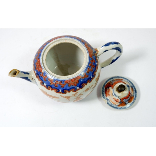 109 - A Chinese 18th century teapot in blue and iron red, 11cm tall - a/f