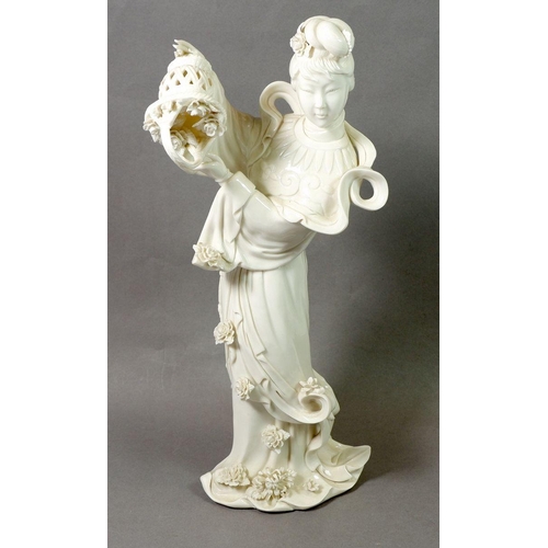 110 - A Chinese modern Blanc De Chine figure of a  lady, 37cm tall