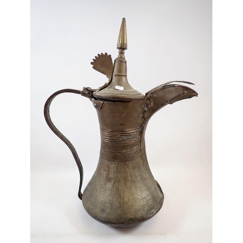 1104 - A 19th century large brass Turkish coffee jug, 41cm tall