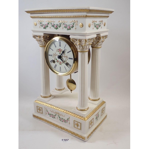 1107 - A Franklin Mint floral porcelain Empress Josephine Portico clock, striking on a bell, hairline to to... 