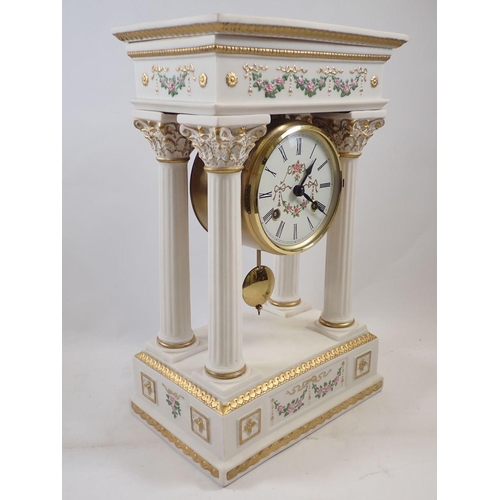 1107 - A Franklin Mint floral porcelain Empress Josephine Portico clock, striking on a bell, hairline to to... 