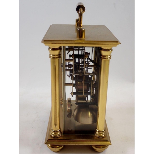 1113 - A Rapport brass striking mantel clock, 14cm tall