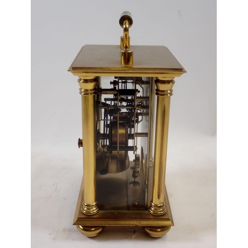 1113 - A Rapport brass striking mantel clock, 14cm tall