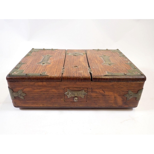 1116 - An oak and brass cigarette and cigar box and a Victorian writing slope - both a/f