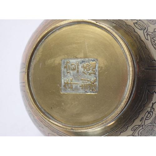 1136 - A Chinese 20th century brass incense burner engraved traditional good fortune decoration within pane... 