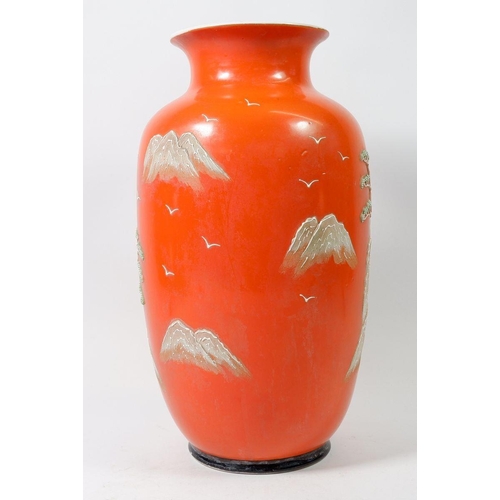 115 - A Japanese orange vase with applied decoration, 31cm