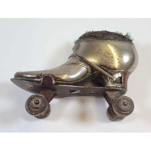 1156 - A  Victorian pin cushion in the form of a roller skate, 6cm and another shoe form one