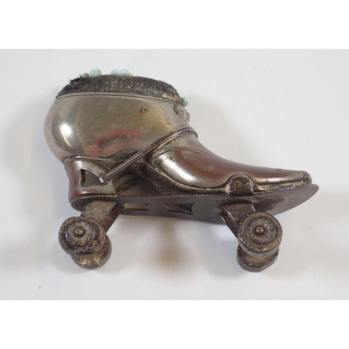 1156 - A  Victorian pin cushion in the form of a roller skate, 6cm and another shoe form one