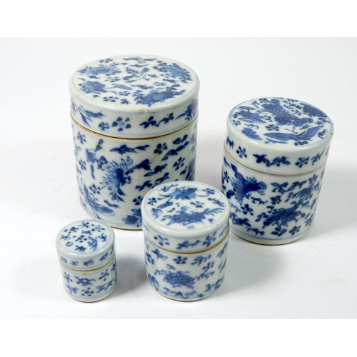 116 - A set of four Chinese blue and white stacking jars painted birds, flowers, bats etc, largest 9cm