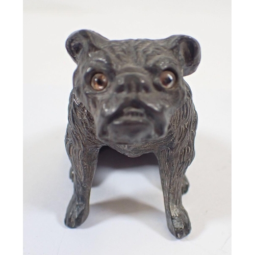 1163 - A Victorian pewter model of lion 8cm long and a spelter bull dog pin cushion with glass eyes