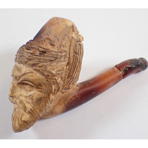 1173 - A small meerchaum pipe carved as a mans head, the mouthpiece a/f, cased