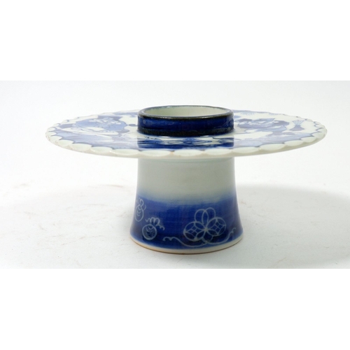 124 - A Japanese blue and white pot with wide brim painted figurative decoration, 15cm diameter