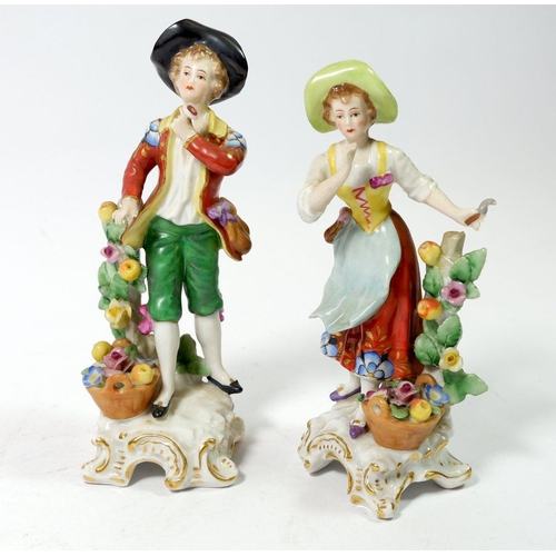 126 - A pair of porcelain figures with gold anchor marks to back, 16cm tall