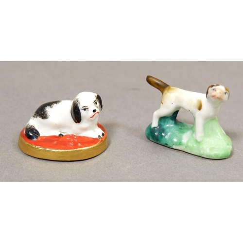 141 - A miniature porcelain spaniel on a cushion with red anchor mark possibly Samson, 3cm wide and a mini... 