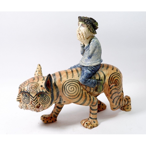 157 - An Amanda Popham studio pottery figure 'He Who Rides the Tiger' 30cm tall