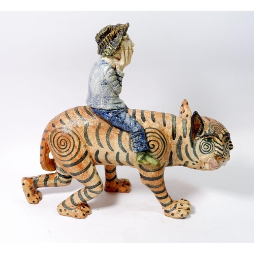157 - An Amanda Popham studio pottery figure 'He Who Rides the Tiger' 30cm tall
