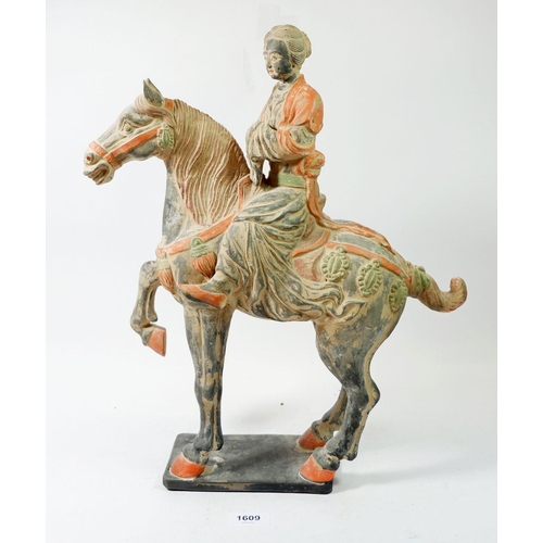 1609 - A large Chinese Tang style terracotta rider and horse, 45cm tall