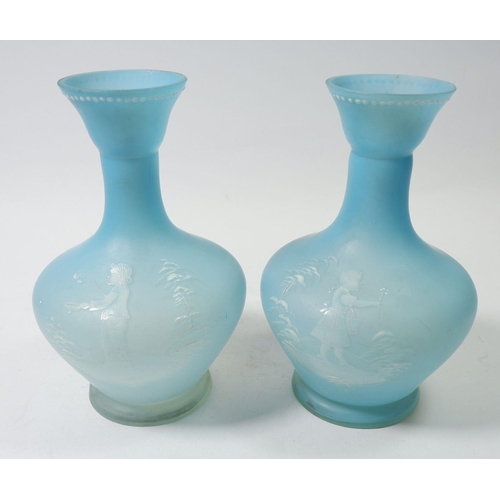 161 - A pair of Mary Gregory style pale blue satin finish glass vases painted boy and girl holding flowers... 