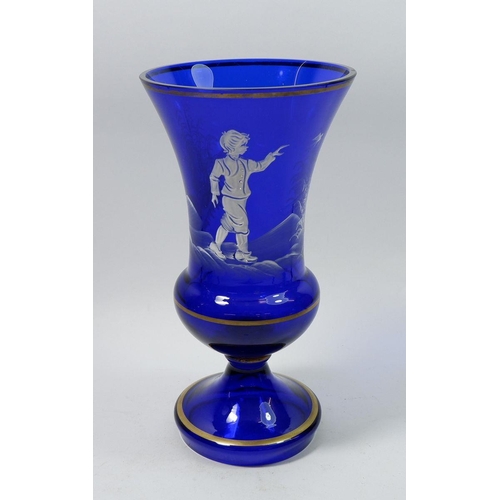 168 - A tall blue Mary Gregory style glass urn form vase painted boy with swallows, 25cm tall