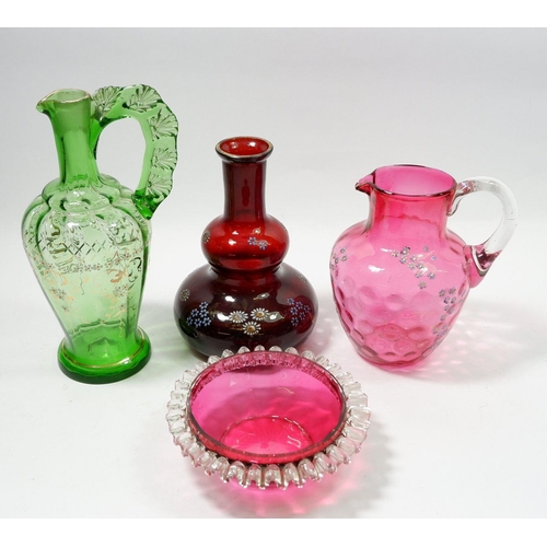 174 - Two Victorian floral painted glass jugs,  a ruby glass carafe painted flowers and a cranberry glass ... 