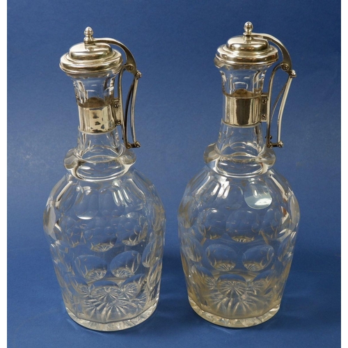 201 - A pair of Edwardian silver plated facet cut decanters with silver plated press action hinged lids