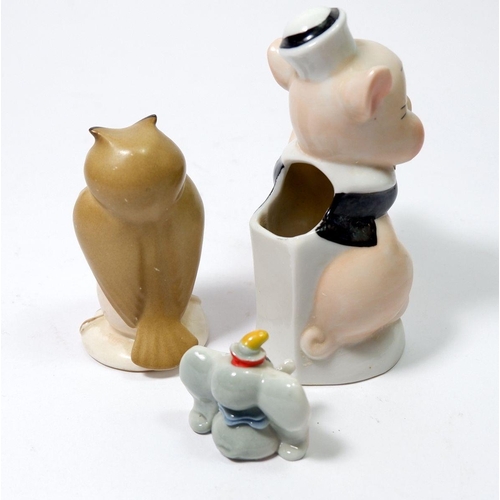 27 - A Walt Disney pig toothbrush holder, a Beswick owl and a Wade Dumbo