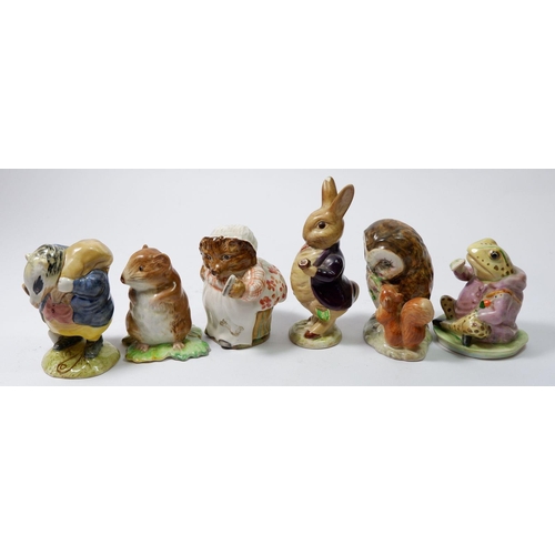 28 - A collection of six early Beswick Beatrix Potter figures including: Mrs Tiggy Winkle, Mrs Flopsy Bun... 