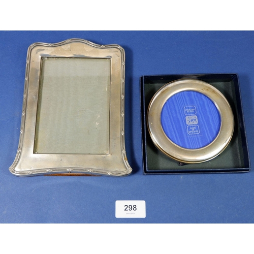 298 - A silver photograph frame, Birmingham 1921, by William Neale & Son Ltd, and a circular frame boxed, ... 