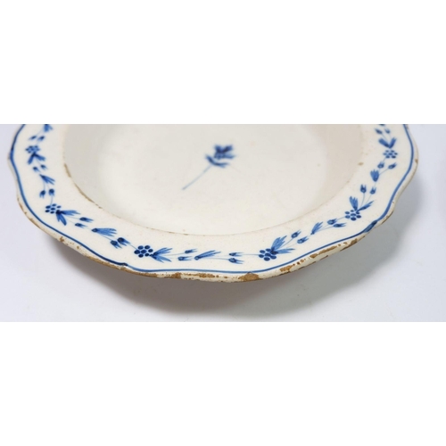 31 - An 18th century blue and white bowl with sprigged decoration and a later Faience plate