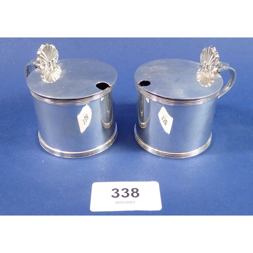 338 - A pair of silver drum mustard pots, London 1978 by C J Vander, 197gm