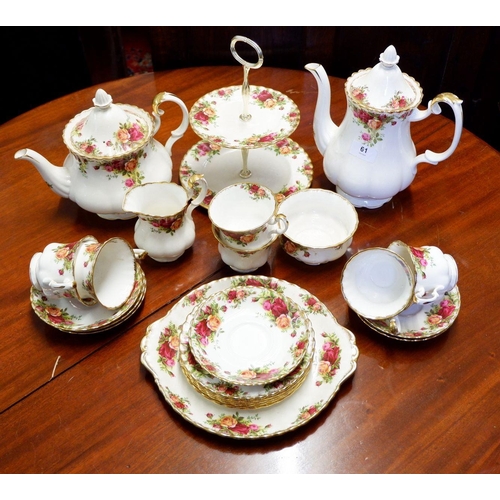 61 - A Royal Albert Country Roses tea service comprising: six cups & saucers, six tea plates, coffee pot,... 