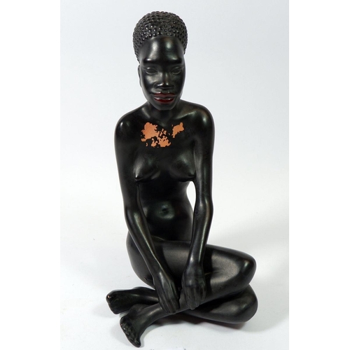 64 - A Gmundner Keramik Fink African seated female figure , 25cm tall