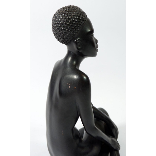 64 - A Gmundner Keramik Fink African seated female figure , 25cm tall