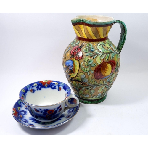 96 - A Majolica style pottery jug and a large breakfast cup and saucer