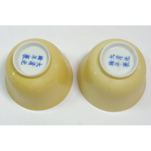 102 - A Chinese pair of eggshell porcelain yellow cups with 'Daqing Guang Xu' mark to base, 4.5cm tall