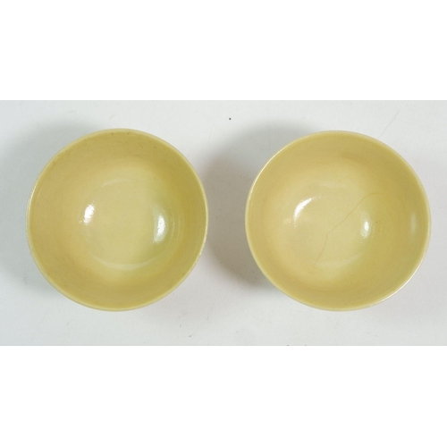 102 - A Chinese pair of eggshell porcelain yellow cups with 'Daqing Guang Xu' mark to base, 4.5cm tall