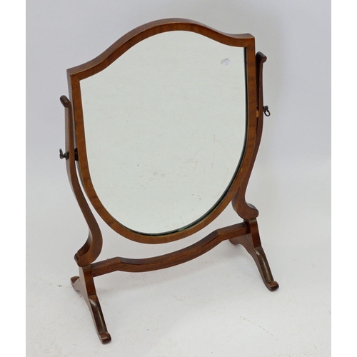 1026 - A mahogany shield form toiletry mirror