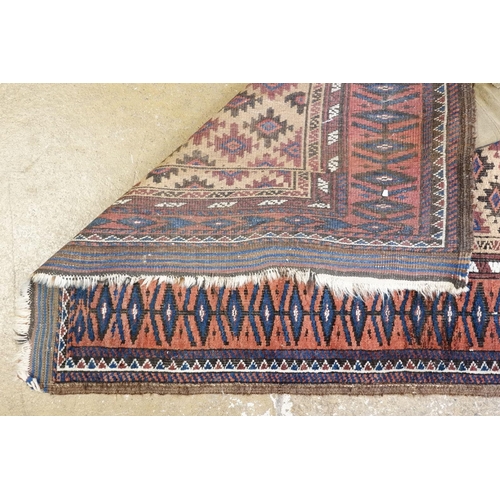 1030 - A Turkoman rug with multiple guls on a beige ground, 150 x 80cm