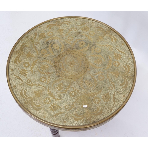 1036 - A brass Benares table on folding wooden stand decorated flowers, 60cm