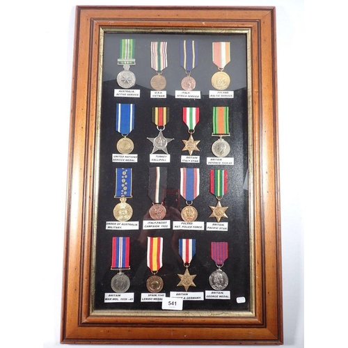 541 - A collection of WWII world medals, framed and glazed, some replicas