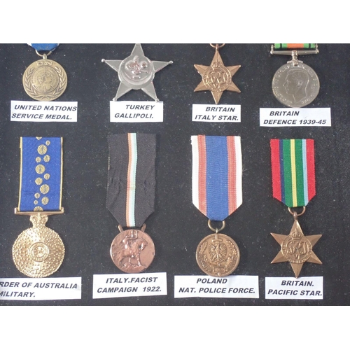 541 - A collection of WWII world medals, framed and glazed, some replicas