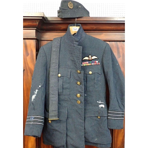 544A - An RAF officers jacket with medal ribbons, side cap and belt