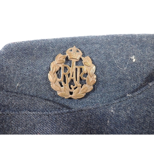 544A - An RAF officers jacket with medal ribbons, side cap and belt