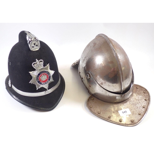 545 - A replica 17th century style helmet with fishtail back and a fake police helmet