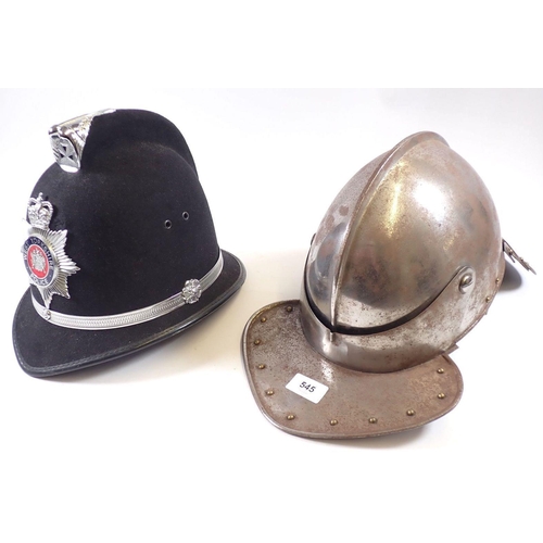 545 - A replica 17th century style helmet with fishtail back and a fake police helmet